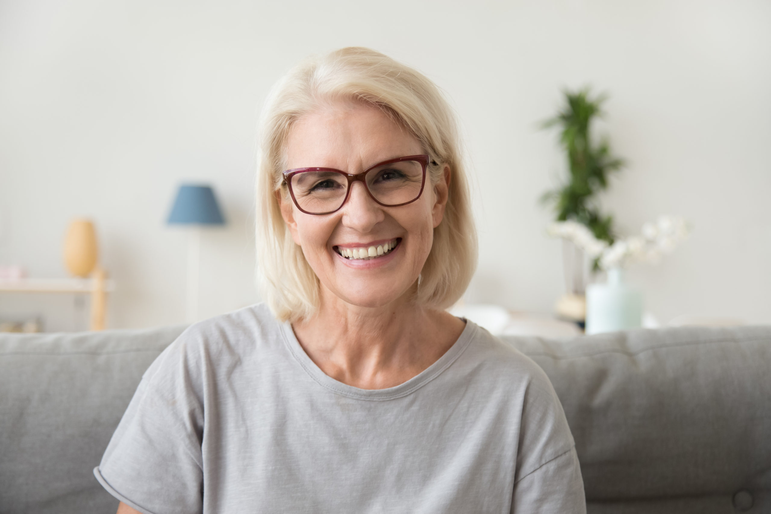 A happy mature woman smiling, restored confidence after implants