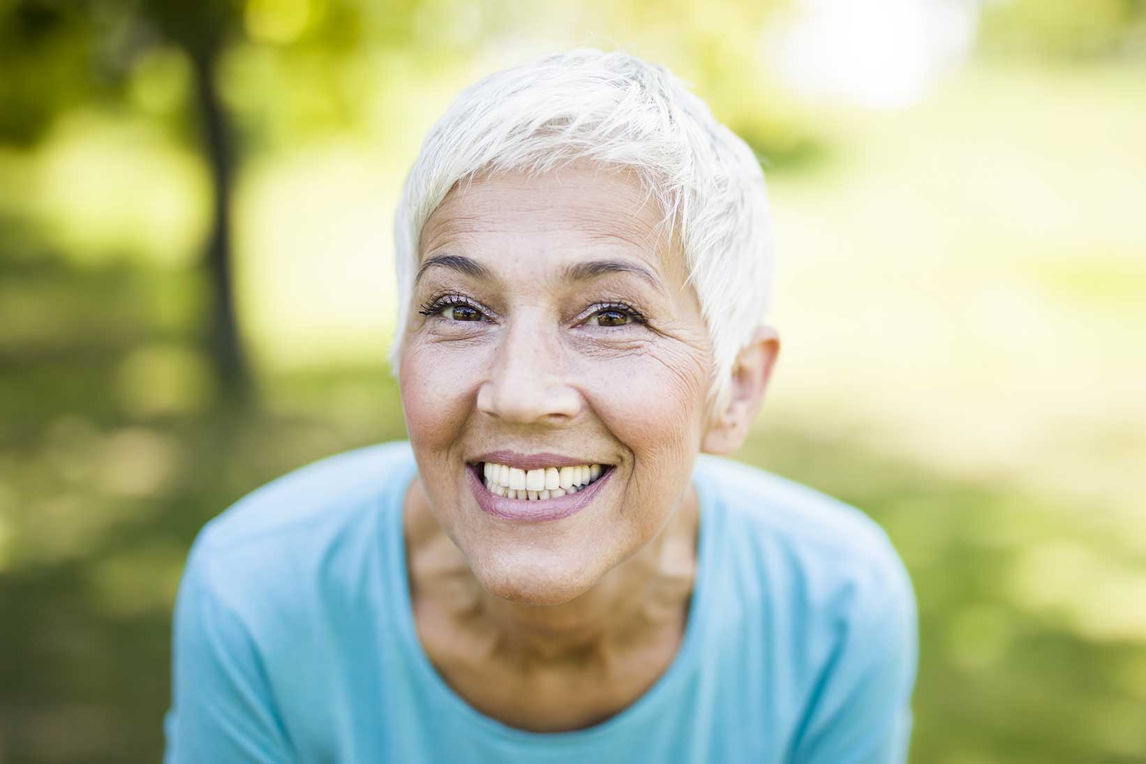 A smiling new patient enjoying time outdoors