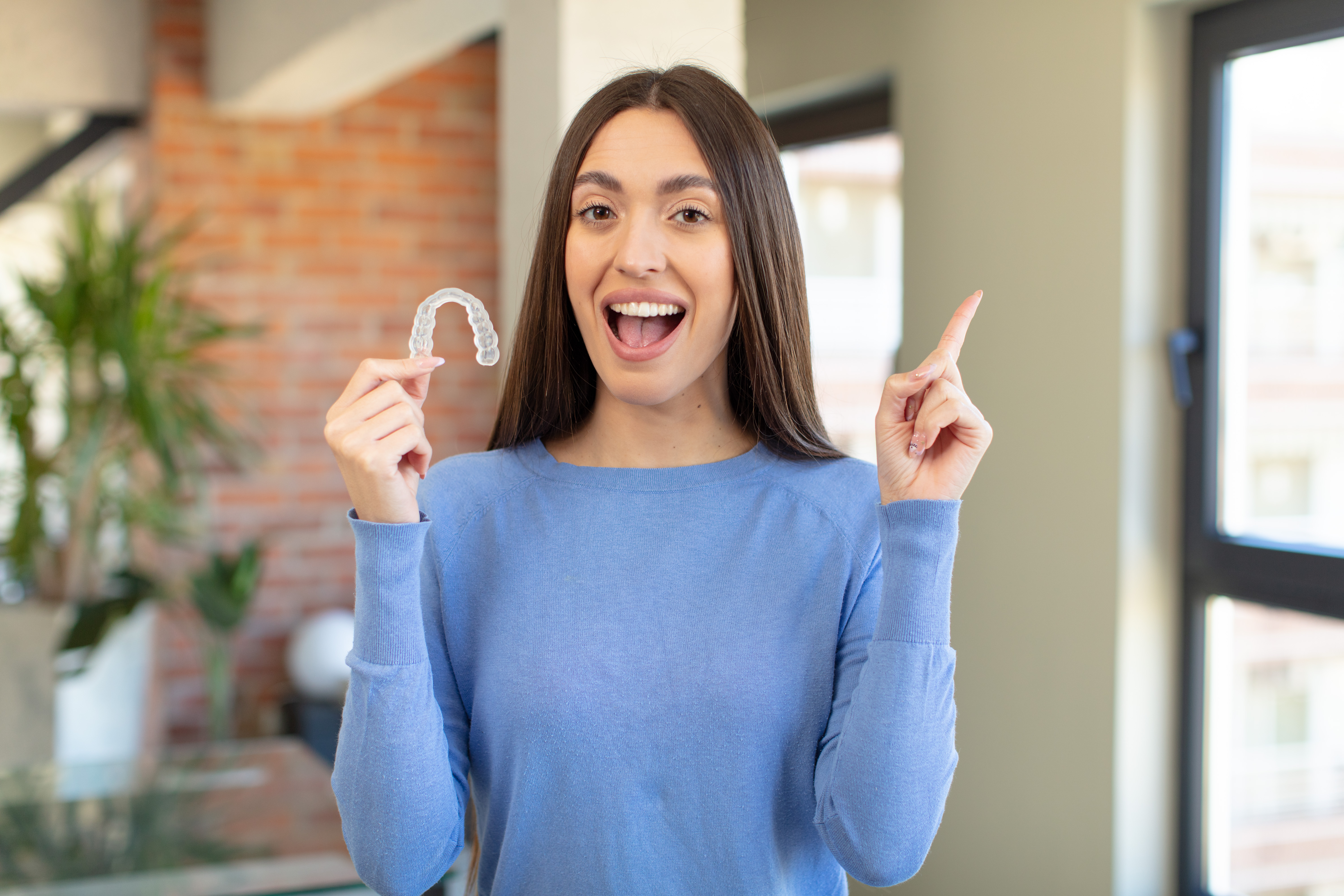 A patient feeling confident and excited about their smile